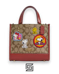 Coach X Peanuts Dempsey Tote Bag 22 In Signature Canvas With Patches CE851